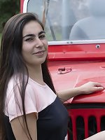 Paris poses naked outdoors by her red jeep